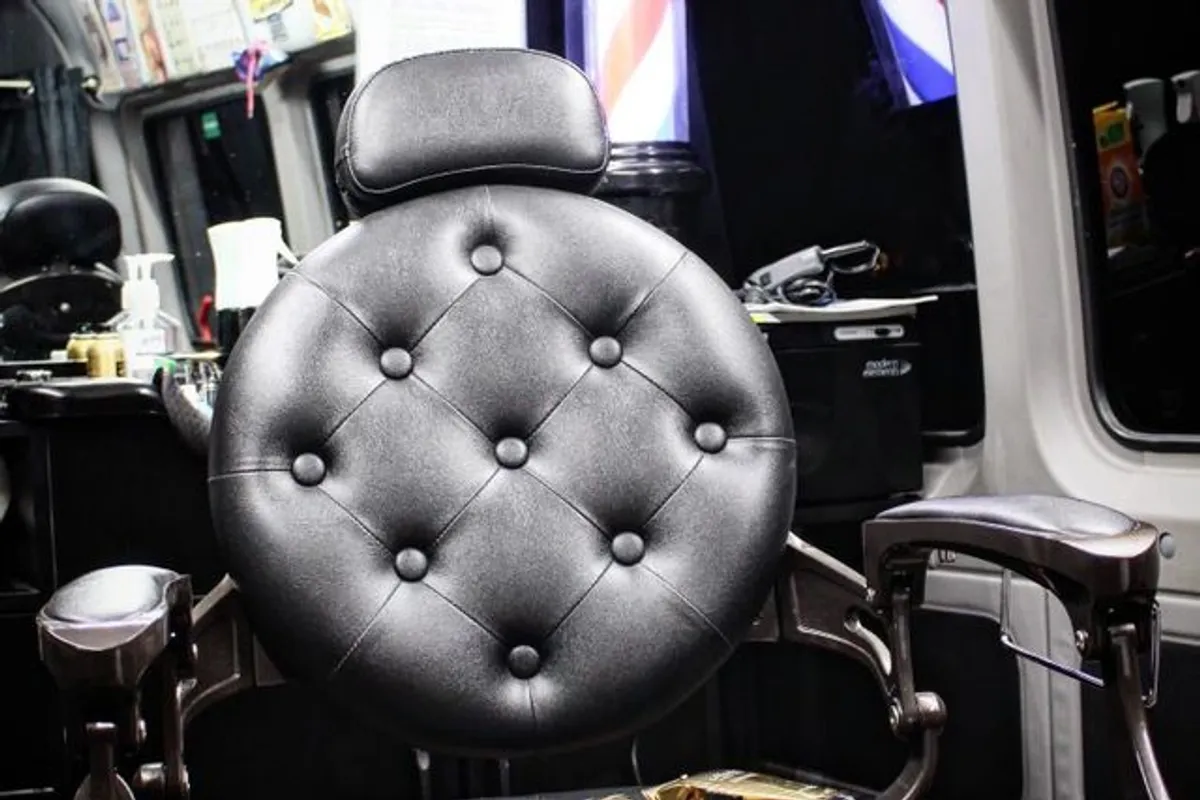 Professional barber chair inside the Slyyyde Kutz mobile grooming setup